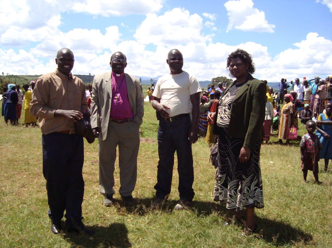 Group of adults standing together at a community gathering